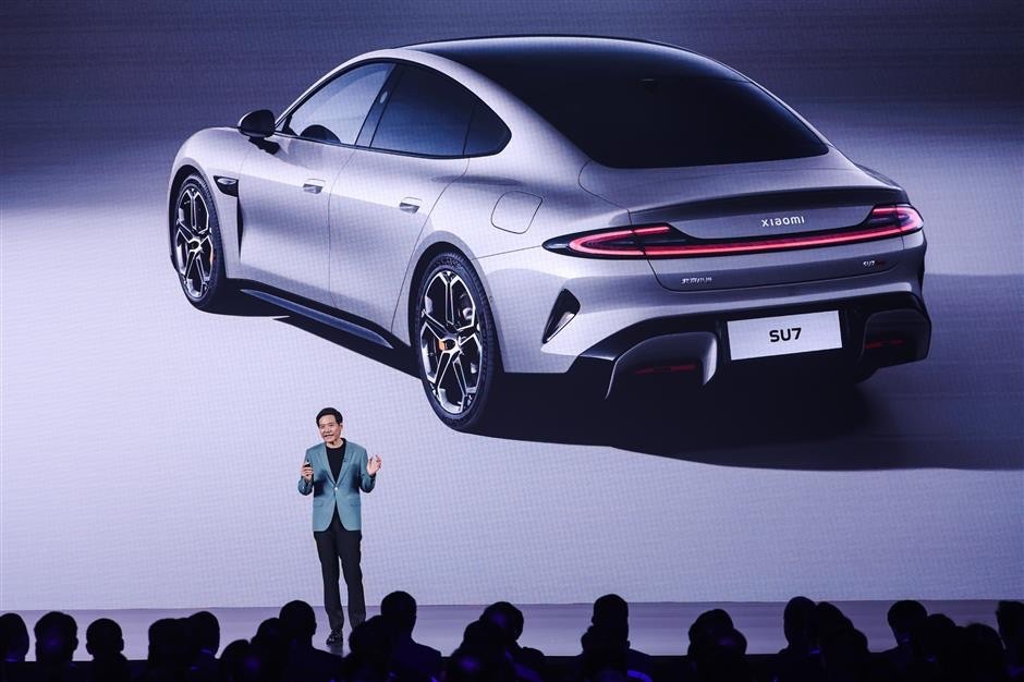 Smartphone maker Xiaomi launches SU7 sedan to compete with Porsche and Tesla