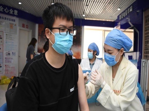 China achieves vaccination target, extends vaccination to minors